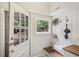 Welcoming entryway with a wood bench, coat hooks, and a view to the exterior at 96 Dartmouth Ave, Avondale Estates, GA 30002