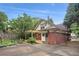 Charming brick home with a pergola-covered patio, inviting outdoor living, and mature landscaping at 96 Dartmouth Ave, Avondale Estates, GA 30002