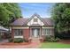 Charming brick home with a gabled roof, manicured landscaping, and inviting front entrance at 96 Dartmouth Ave, Avondale Estates, GA 30002