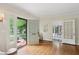 Welcoming foyer with light blue doors, hardwood floors, and view of the front yard and office beyond at 96 Dartmouth Ave, Avondale Estates, GA 30002