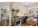 Modern kitchen with stainless steel range, granite countertops, and hardwood floors at 96 Dartmouth Ave, Avondale Estates, GA 30002