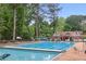 Large swimming pool with chairs and tables perfect for relaxation at 96 Dartmouth Ave, Avondale Estates, GA 30002