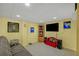 Basement living room with TV, carpet, and furniture at 222 Mossy Pl, Alpharetta, GA 30005
