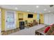 Basement living room with walk out door, TV, and furniture at 222 Mossy Pl, Alpharetta, GA 30005
