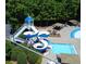 A community pool area featuring a waterslide, gazebo and plenty of seating at 222 Mossy Pl, Alpharetta, GA 30005