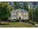 Charming two-story home with a well-manicured lawn, complemented by mature trees for added privacy at 222 Mossy Pl, Alpharetta, GA 30005