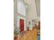 Elegant foyer with hardwood floors, high ceilings, and a view of the dining room at 222 Mossy Pl, Alpharetta, GA 30005