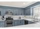 Updated kitchen with granite countertops, stainless steel appliances, and a stylish backsplash at 222 Mossy Pl, Alpharetta, GA 30005