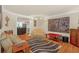 Spacious living room with hardwood floors and ample seating at 222 Mossy Pl, Alpharetta, GA 30005