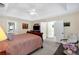 Spacious main bedroom with tray ceilings, carpeting, and neutral tones at 222 Mossy Pl, Alpharetta, GA 30005