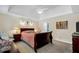 Spacious main bedroom features a ceiling fan, tray ceiling, neutral walls, and carpet at 222 Mossy Pl, Alpharetta, GA 30005
