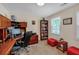 Office with built-in shelving, wood desk, chair, and natural light at 222 Mossy Pl, Alpharetta, GA 30005