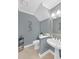 Tastefully decorated powder room with pedestal sink and modern fixtures at 222 Mossy Pl, Alpharetta, GA 30005