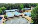 Aerial view of the community's well-maintained tennis courts, set amongst lush greenery at 222 Mossy Pl, Alpharetta, GA 30005