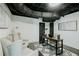 Finished basement featuring a desk, chairs and a patterned rug at 2276 Sutton Se St, Atlanta, GA 30317