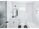 Modern bathroom featuring stylish subway tiles, black fixtures, and a spacious shower at 2276 Sutton Se St, Atlanta, GA 30317