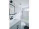 A clean bathroom with a white vanity, black fixtures, subway tile and black and white flooring at 2276 Sutton Se St, Atlanta, GA 30317