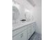 Bathroom featuring double vanity, modern fixtures and a herringbone tile floor at 2276 Sutton Se St, Atlanta, GA 30317