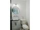 Elegant bathroom featuring subway tile, modern fixtures, round mirror, and a clean, bright design at 2276 Sutton Se St, Atlanta, GA 30317