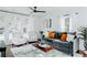 Stylish living room with large windows, hardwood floors, and modern furniture at 2276 Sutton Se St, Atlanta, GA 30317