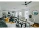 Cozy living room flowing to the modern kitchen and dining area, filled with natural light and stylish furnishings at 2276 Sutton Se St, Atlanta, GA 30317