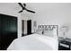 Bedroom with modern ceiling fan, hardwood floors, neutral walls, and black bedroom door at 2276 Sutton Se St, Atlanta, GA 30317