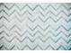 Close-up of a bathroom featuring a herringbone tile floor at 2276 Sutton Se St, Atlanta, GA 30317