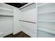 A walk-in closet with dark trim and white shelving at 2276 Sutton Se St, Atlanta, GA 30317