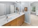 Large bathroom features double sinks, a vanity, a tub/shower, and neutral decor at 331 Franklin Ln, Acworth, GA 30102