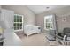 Cozy Bedroom featuring ample natural light, a crib, a glider, and peaceful decor at 331 Franklin Ln, Acworth, GA 30102
