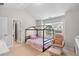 Bright bedroom featuring a charming canopy bed, chair, and large window for natural light at 331 Franklin Ln, Acworth, GA 30102