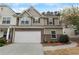 Charming townhome with a two-car garage and inviting curb appeal in a well-maintained community at 331 Franklin Ln, Acworth, GA 30102