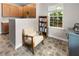 Cozy kitchen nook area with a chair, bookcase, and ample natural light, providing a relaxing space at 331 Franklin Ln, Acworth, GA 30102