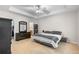 Spacious main bedroom with tray ceiling, fan, carpet, and ample closet space at 331 Franklin Ln, Acworth, GA 30102