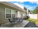 Back patio with table and chairs, ideal for outdoor dining and entertaining at 331 Franklin Ln, Acworth, GA 30102
