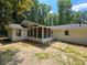 Rear view of the home, featuring a screened in porch, and nice back yard at 345 Forest Valley Rd, Lawrenceville, GA 30046