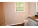 Modern bathroom featuring a stylish vanity with gray countertop and sleek white cabinetry at 345 Forest Valley Rd, Lawrenceville, GA 30046