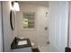 Updated bathroom with modern vanity, walk-in shower, white tile, and stylish fixtures at 345 Forest Valley Rd, Lawrenceville, GA 30046