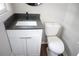 Bathroom features a sleek modern vanity, toilet, and updated fixtures at 345 Forest Valley Rd, Lawrenceville, GA 30046