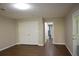 This large bedroom features wood-look floors and an attached closet and hallway at 345 Forest Valley Rd, Lawrenceville, GA 30046