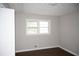 Cozy bedroom featuring a window, closet, neutral walls, and hardwood flooring at 345 Forest Valley Rd, Lawrenceville, GA 30046