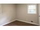 Neutral bedroom with natural light, updated flooring, and large windows at 345 Forest Valley Rd, Lawrenceville, GA 30046