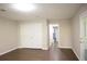 This large bedroom features wood-look floors and an attached closet and hallway at 345 Forest Valley Rd, Lawrenceville, GA 30046