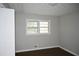 Cozy bedroom featuring a window, closet, neutral walls, and hardwood flooring at 345 Forest Valley Rd, Lawrenceville, GA 30046