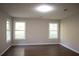 This large, freshly painted bedroom features wood-look floors and lots of natural light at 345 Forest Valley Rd, Lawrenceville, GA 30046