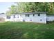 Charming white brick ranch-style home with lush front lawn and manicured landscaping at 345 Forest Valley Rd, Lawrenceville, GA 30046