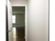 The view from the hallway shows natural light and wood-look flooring in a freshly painted home at 345 Forest Valley Rd, Lawrenceville, GA 30046