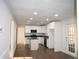 Contemporary kitchen with white cabinets, modern appliances, and an island at 345 Forest Valley Rd, Lawrenceville, GA 30046