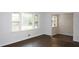 Bright living room features large windows and hardwood floors, offering a welcoming space at 345 Forest Valley Rd, Lawrenceville, GA 30046