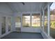 Bright sunroom with multiple windows, door and outdoor views, creating a relaxing space at 345 Forest Valley Rd, Lawrenceville, GA 30046
